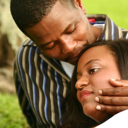 african-american couple comforting each other