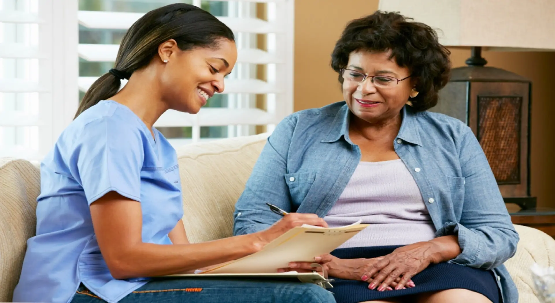 nurse notetaking with a patient