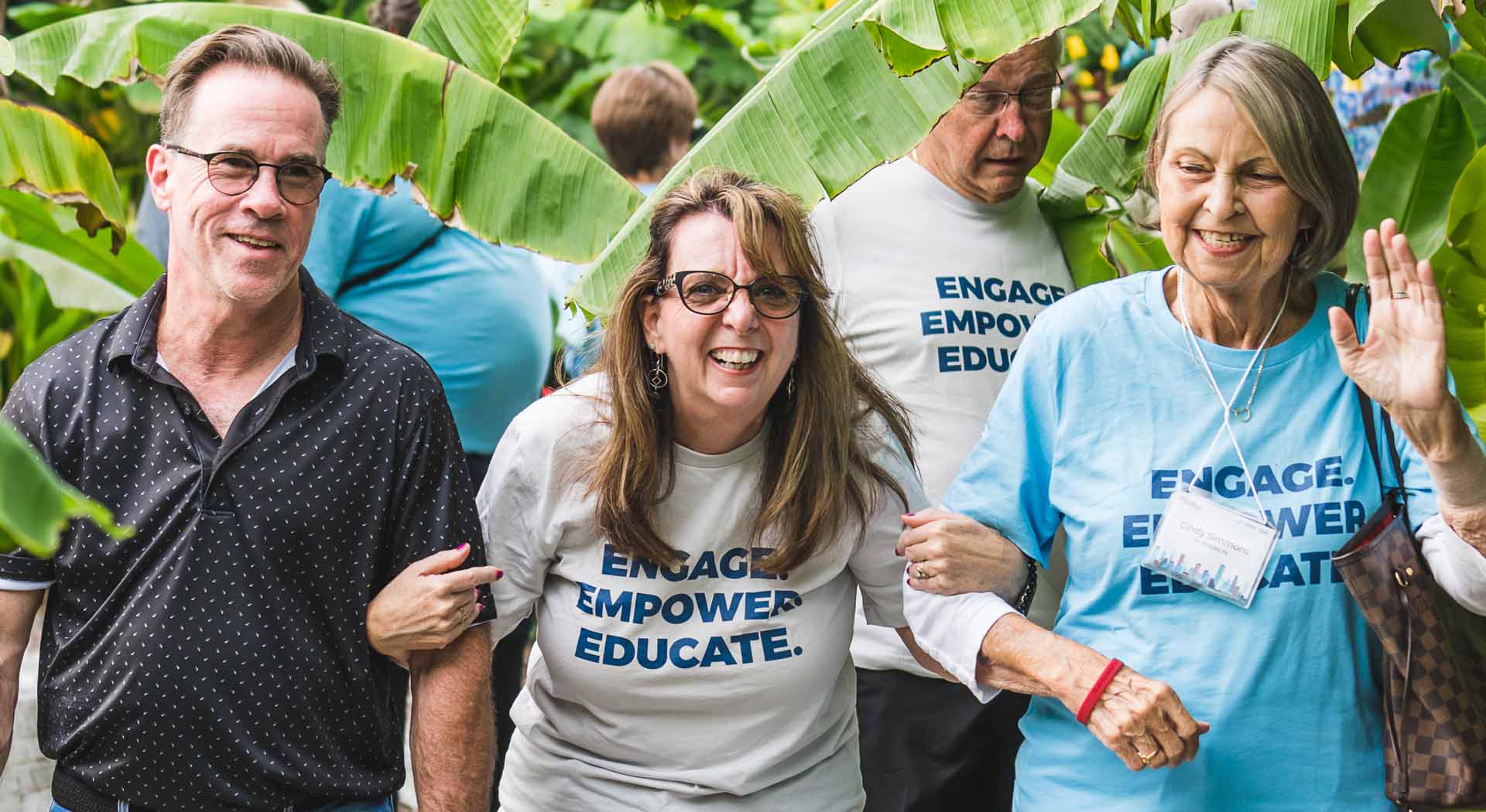 Support Group Leader Summit (SGLS) attendees walk through nature together