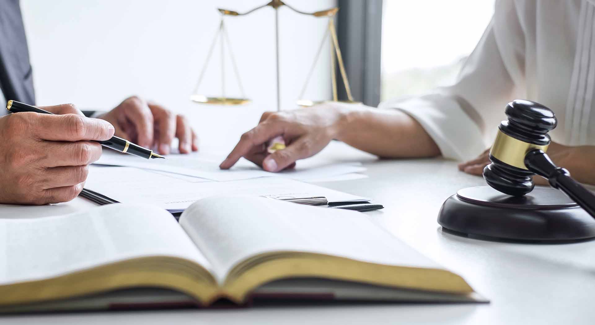 Businesspeople confer about advocacy in a legal setting