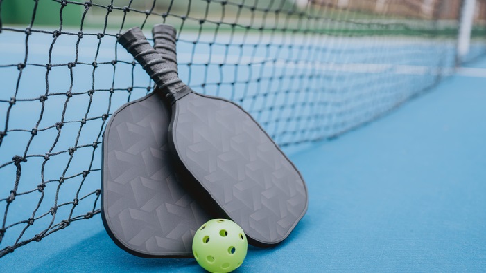 pickleball, racquets, and ball