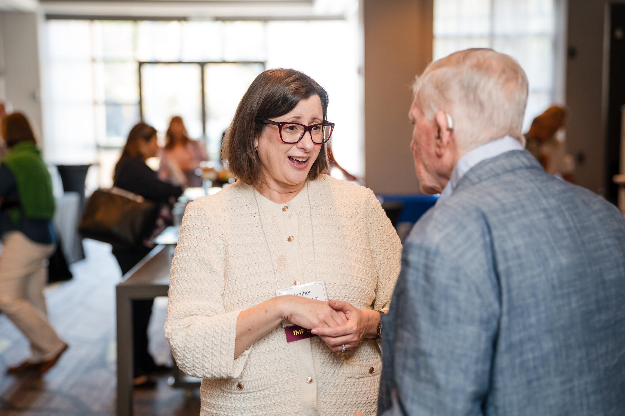 IMF President and CEO Heather Cooper Ortner and a patient