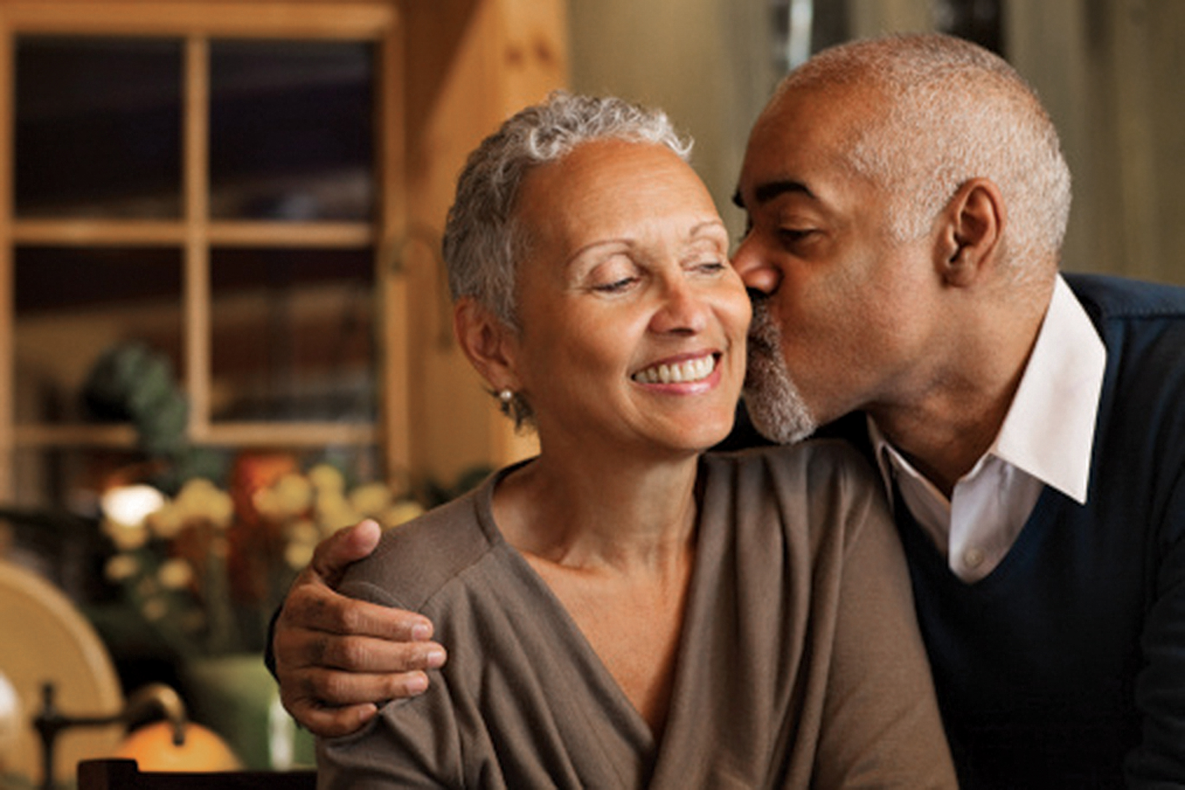 elderly couple man kissing women