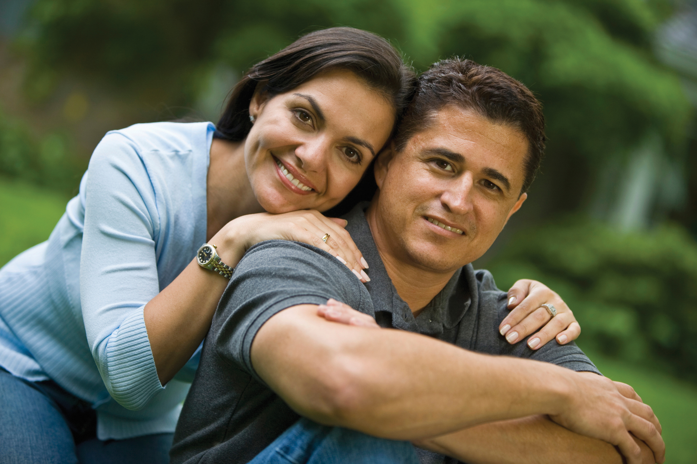 woman leaning on man's shoulder