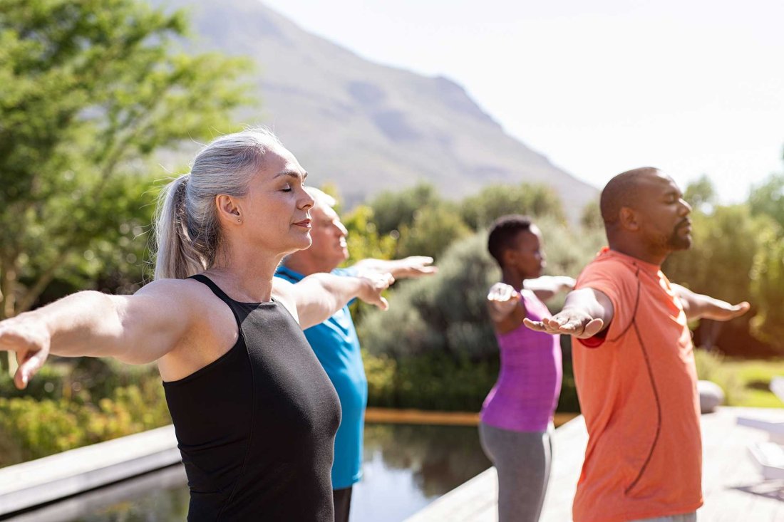 Group of elderly diverse people doing yoga
