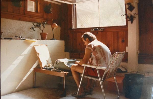 Brian Novis typing on typewriter