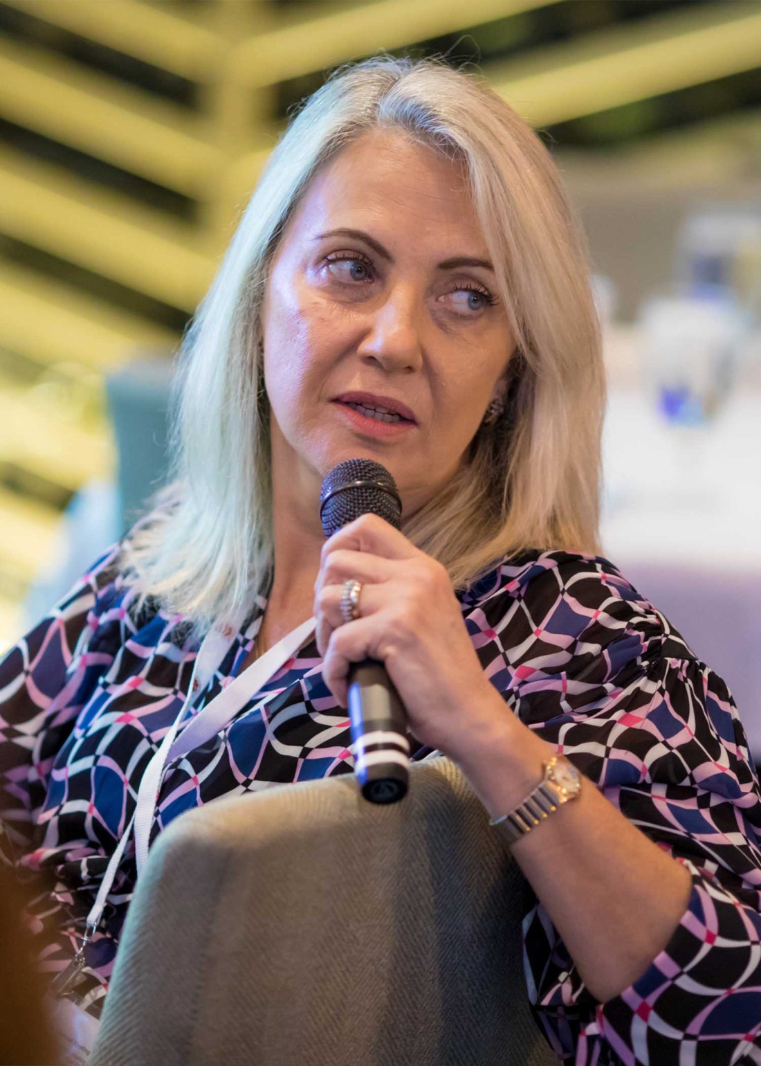 Dr. Vania Hungria with microphone
