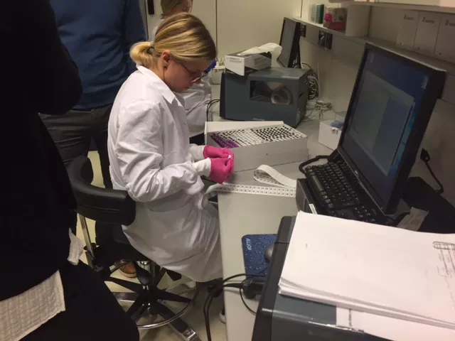 istopmm lab technician with blood samples