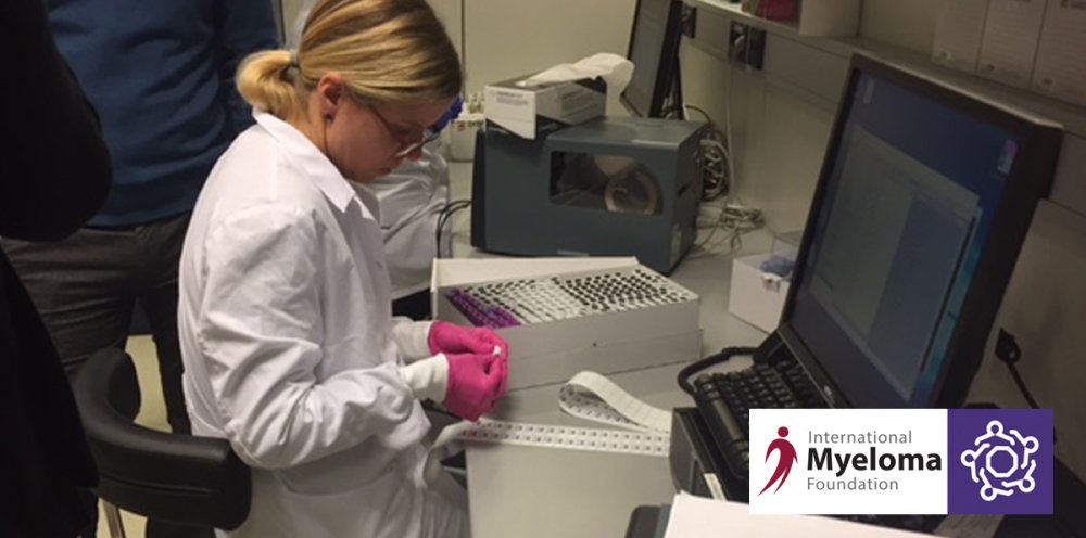 Lab technician reads data from a computer screen