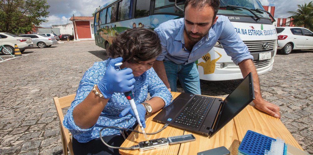 People testing blood at an outdoor table