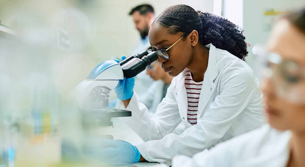 young African American female doctor studying in a lab