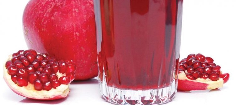 pomegranate with glass of pomegranate juice