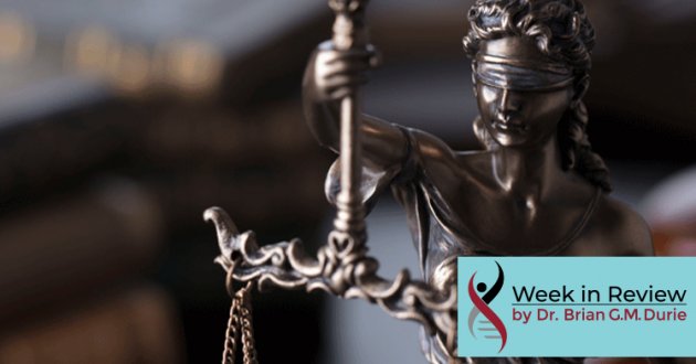 Bronze statue in front of law books