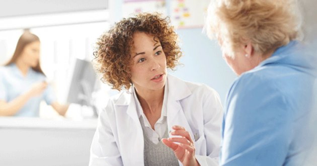Doctor speaks to patient