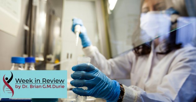 female scientist in laboratory gloved with mask