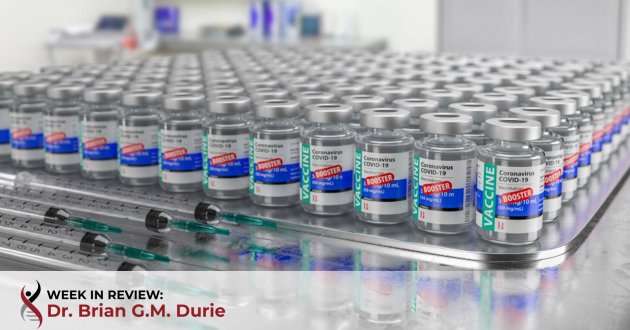 multiple covid 19 vaccine booster vials on table
