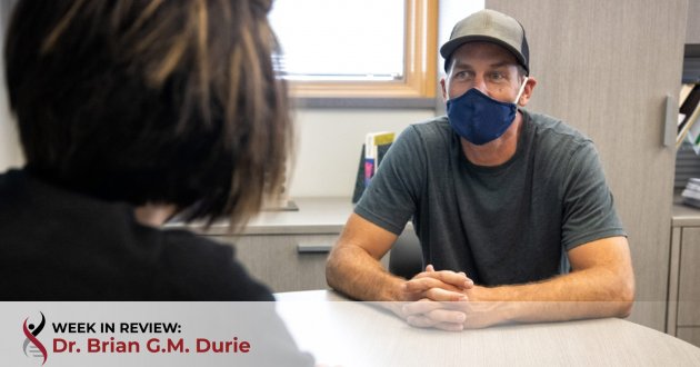 Health care worker with patient in mask