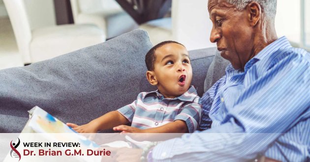 Grandfather reads to his grandson