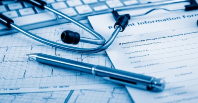 medical charts with pen and stethoscope