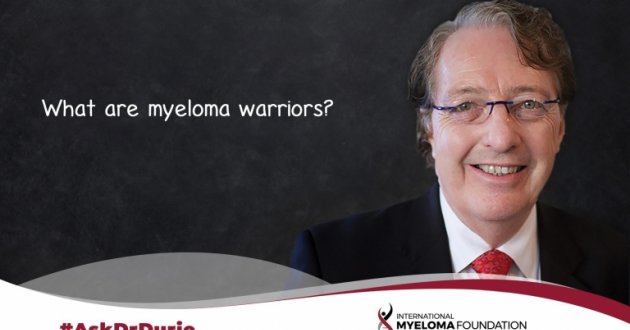 Video still of Dr. Brian G.M. Durie with chalkboard backdrop and text overlay: What are myeloma warriors?