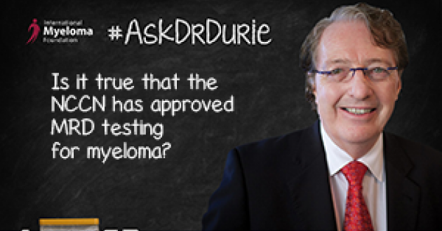 Dr. Durie in fornt of a chalk board
