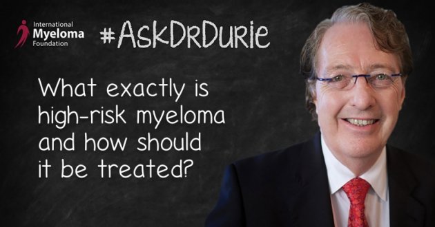 Dr. Durie in front of a chalk board
