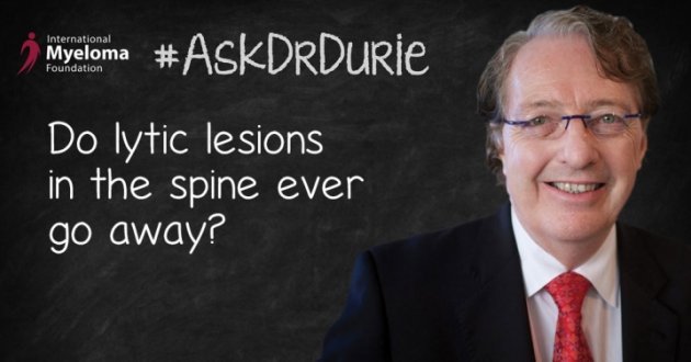 Dr. Durie in front of a chalk board