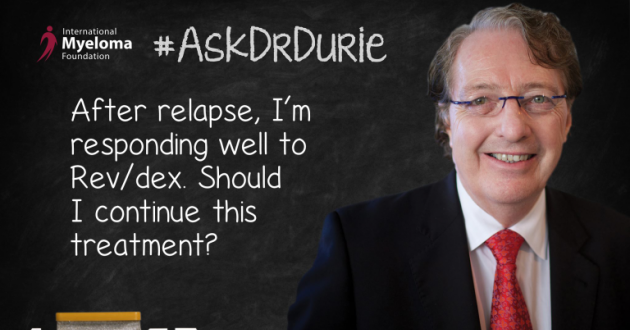 Dr. Durie in front of a chalk board