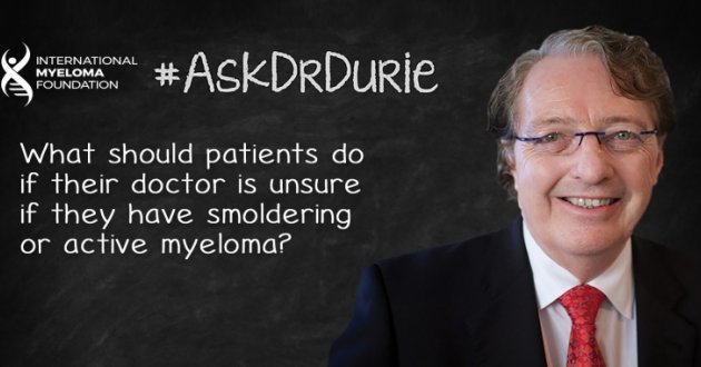 Dr. Durie in front of a chalk board