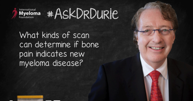 Dr. Durie in front of a chalk board