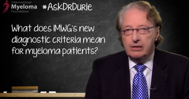 Dr. Durie in front of a chalk board