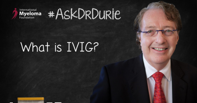 Dr. Durie in front of a chalk board.
