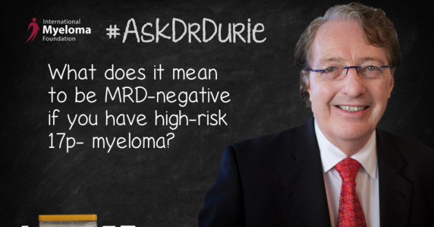 Dr. Durie in front of a chalk board