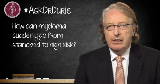 Dr. Durie in front of a chalk board