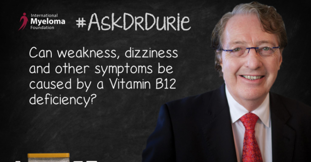 Dr. Durie in front of a chalk board