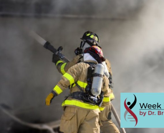 firefighters with houses and billowing smoke