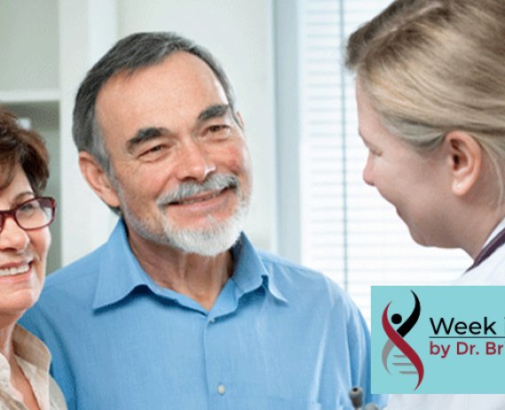Doctor talks to smiling couple
