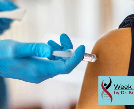 Gloved hand injects needle in arm