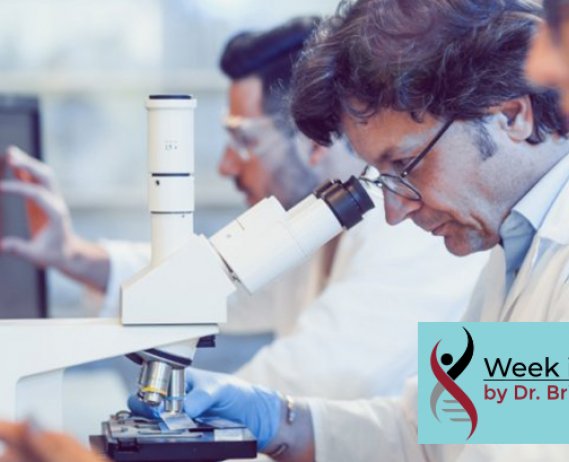People in lab researching, looking at computer screens and microscope