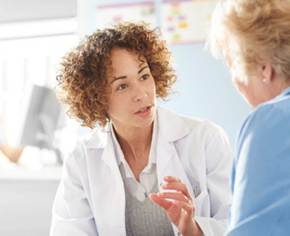 Doctor speaks to patient