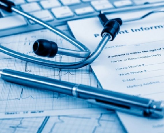 medical charts with pen and stethoscope