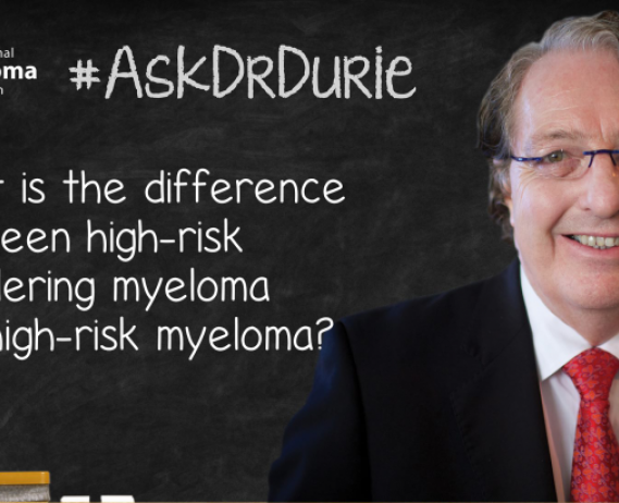 Dr. Durie in front of a chalk board