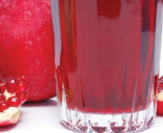 pomegranate with glass of pomegranate juice