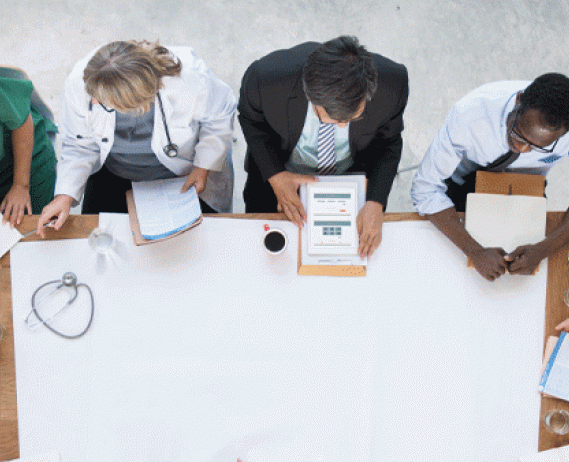 Doctors discuss and share news at table