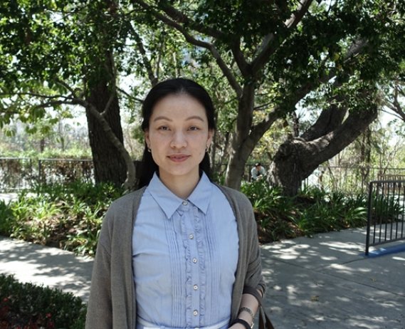 Image of Dr. Shenmiao Yang in front of a forest.