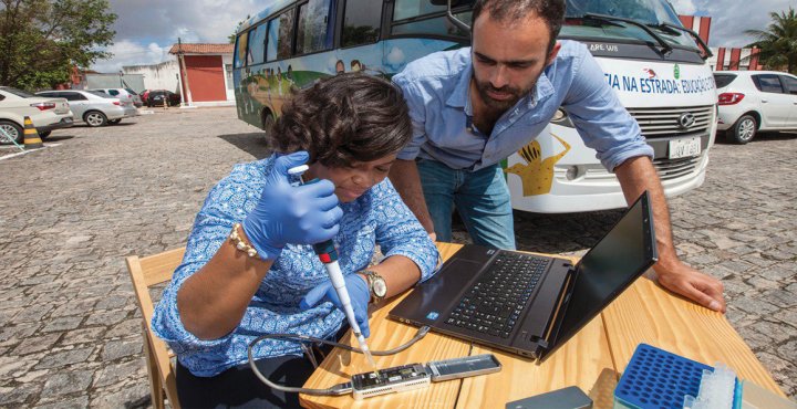 People testing blood at an outdoor table