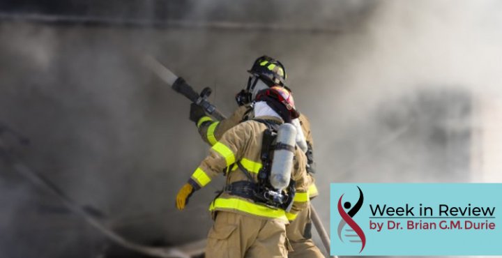 firefighters with houses and billowing smoke