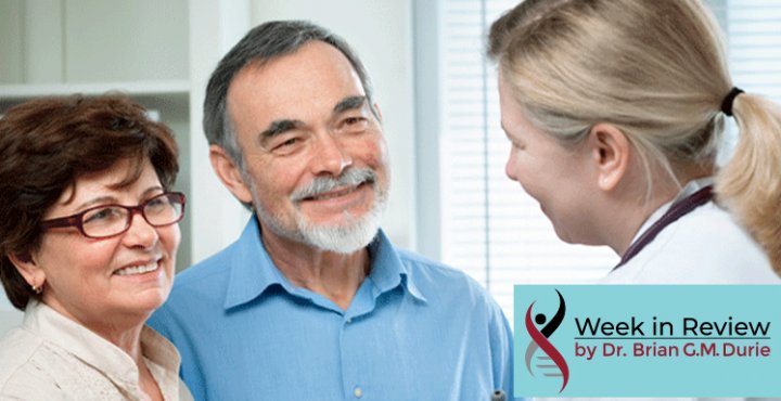 Doctor talks to smiling couple