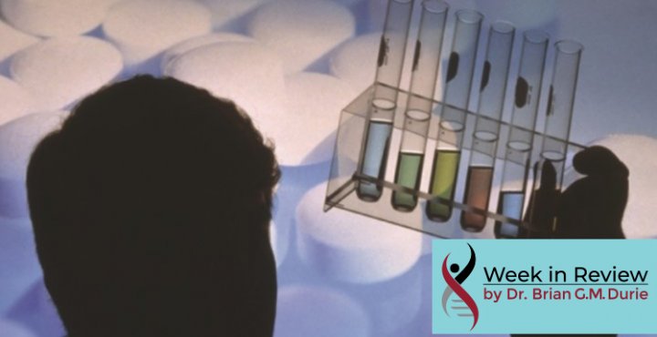 silhouette of man staring at test tubes
