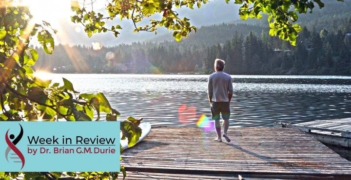 Man standing on a lakeside dock